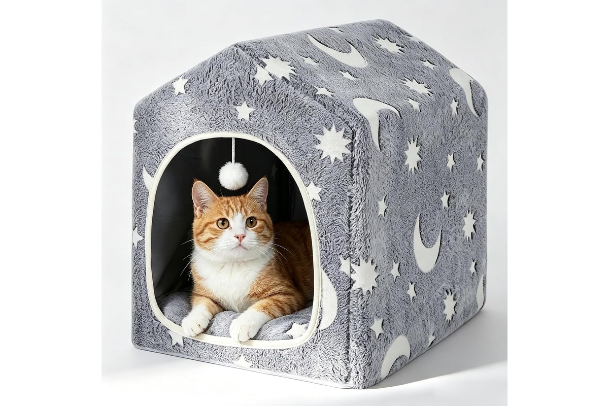 An enclosed cave-style cat bed with a soft plush lining and a supporting frame