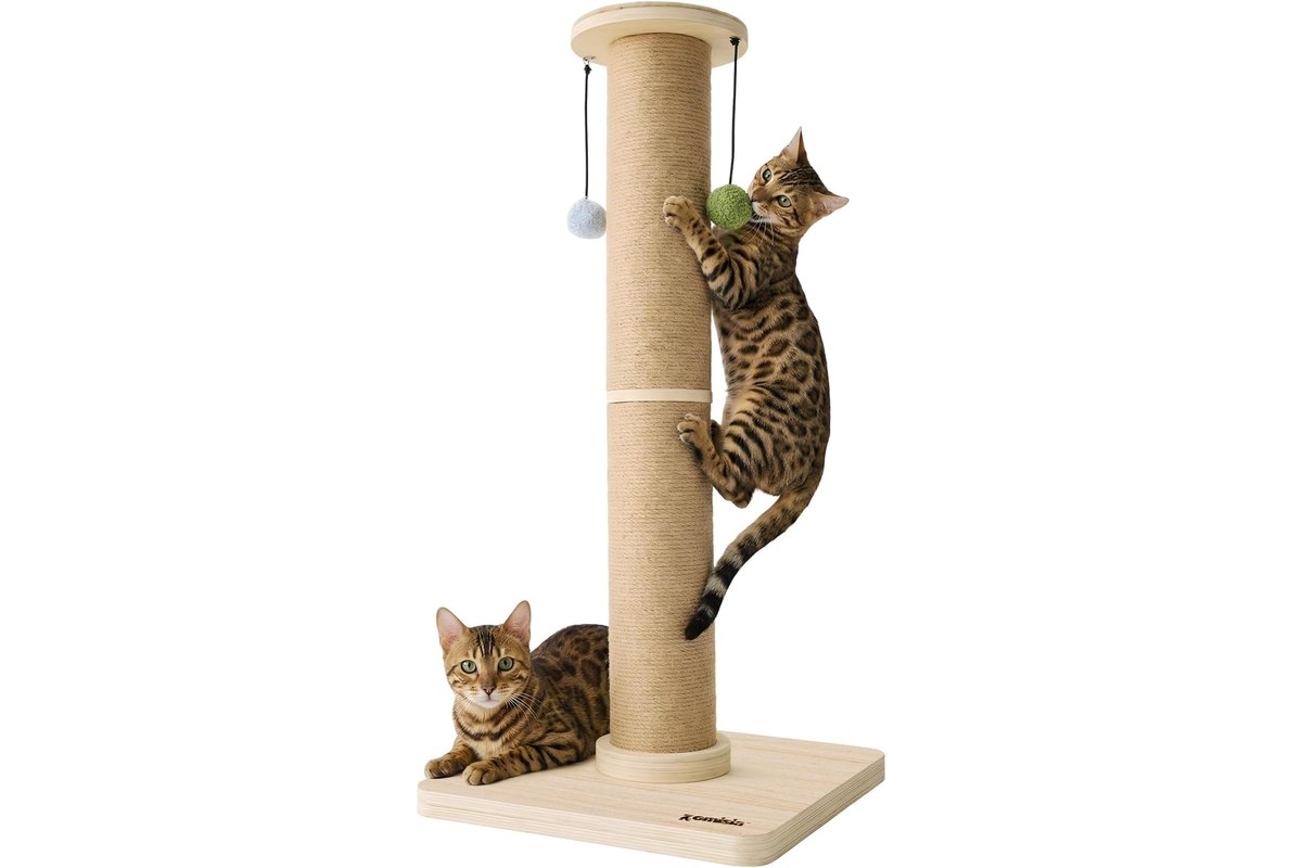 A tall sisal-wrapped cat scratching post on a thick wooden base with a sisal top and dangling balls